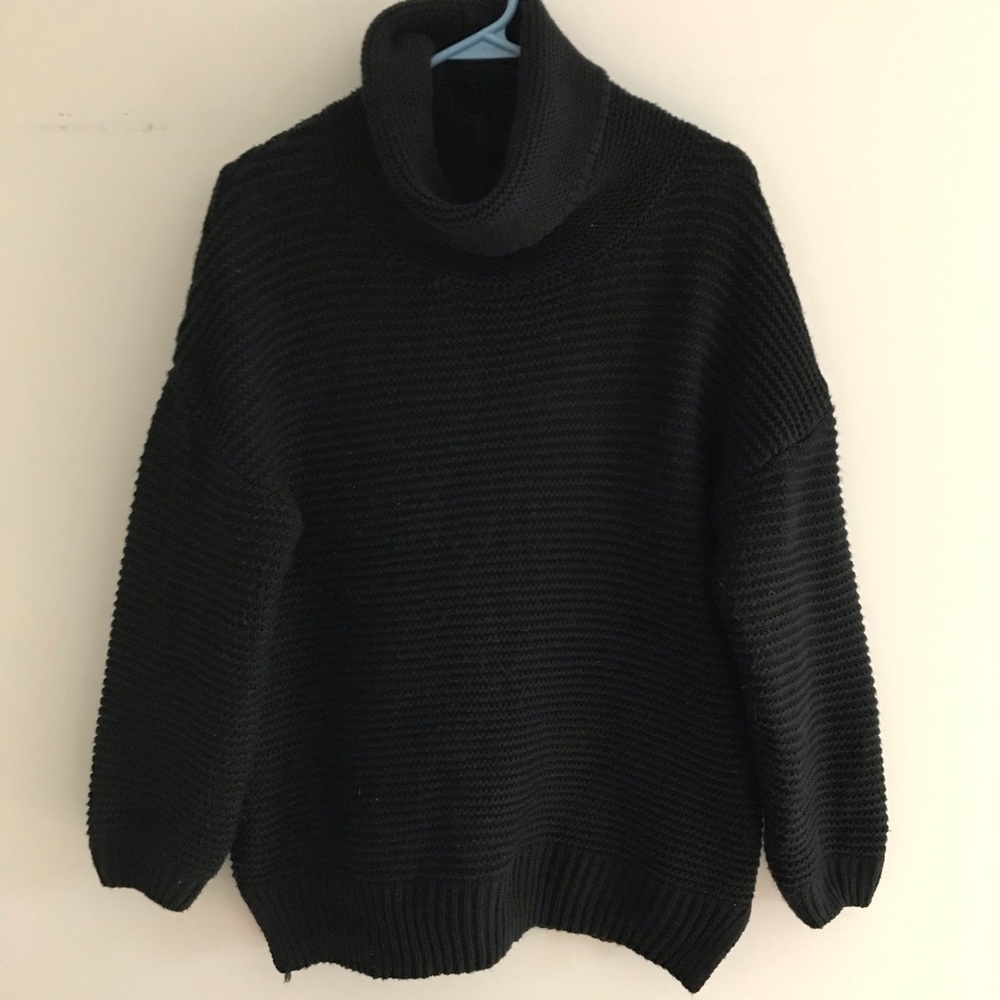 Black chunky knit turtleneck sweater.